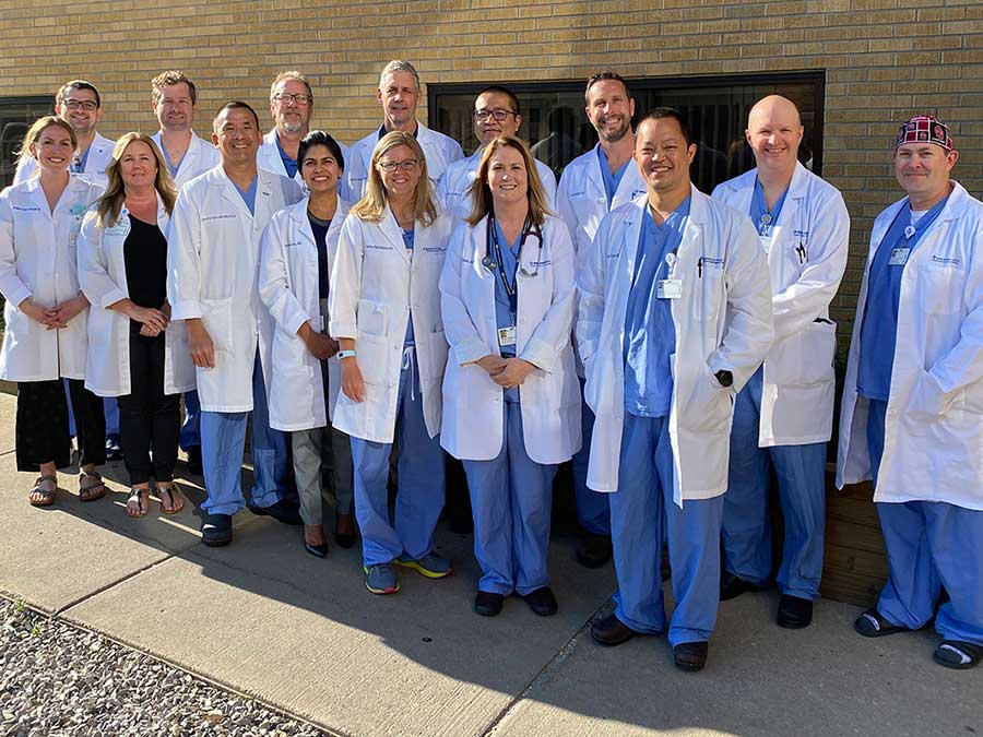 Doctors wearing embroidered lab coats