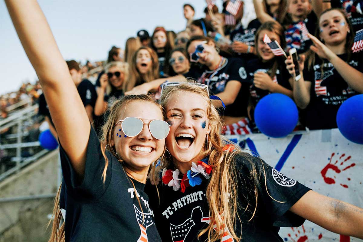 Football fans wearing patriotic t-shirts