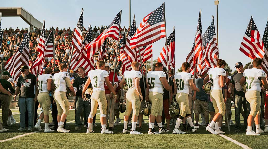 Football players and American flags patriot game